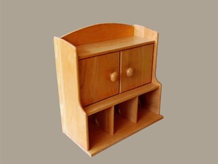 The gray background in the picture is a brown wooden wall mounted shelving unit that can be used as a multipurpose storage cabinet or medicine cabinet in the home. It has many compartments and is comp