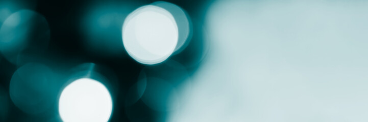 Blurred lights, dark blue background, banner texture. Abstract bokeh with soft light header. Wide screen wallpaper. Panoramic web banner with copy space for design