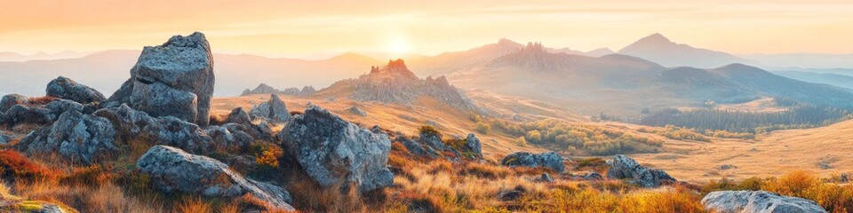 Obraz premium Golden hour light bathes a rocky mountain landscape in warm hues. Serene autumn scenery.