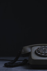 Retro telephone on black background. Closeup image.