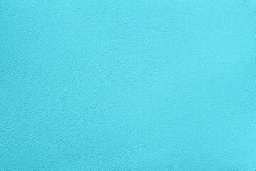 Minimalist close-up of smooth turquoise leather texture. Bright turquoise textured background showcasing smooth, vivid hue perfect for design projects, creative artwork, background, fashion design