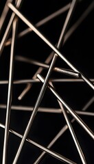 Abstract composition featuring metallic rods against a dark background