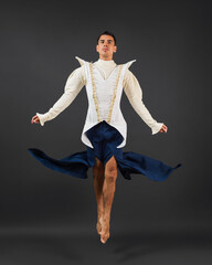 Man in Theatrical Costume Leans in Mid-Air
