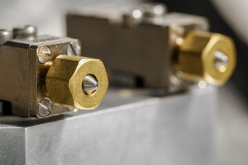 Detail of the brass nozzles on the device.
