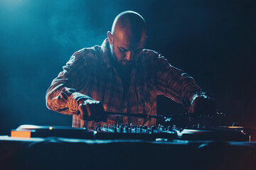 Charismatic DJ Spinning Beats at a Nightclub Party with Premium CD Players