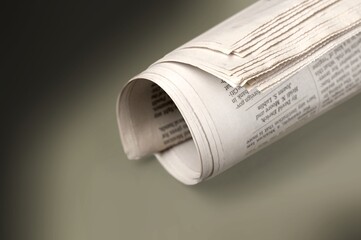Many newspapers as background in modern office