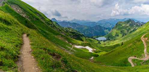 Mountain landscape view near Nebelhorn Summit with lush greenery and hiking trails