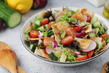 A bowl with Fattoush - Traditional Levantine salad