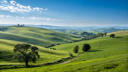 Obraz premium Rolling green hills under a bright blue sky peace