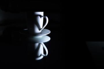 White mug on black backdrop with copy space. Love couple minimal concept with copy space. Mother Day, Valentines Day, greeting card design. 