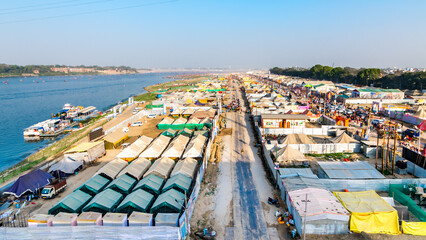 Aerial view of tent city and Triveni Sangam at The Maha Kumbh Mela in Prayagraj, Uttar Pradesh, India. The Mahakumbh Mela is a Hindu festival that happens every 12 years. © mrinal