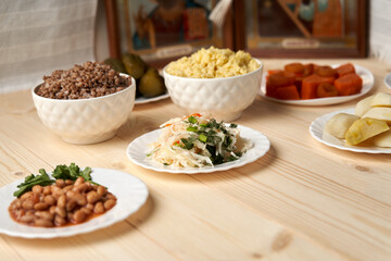 Lenten food on a wooden background symbolizes simplicity and humility, which help the believer focus on spiritual life in the days of Great Lent