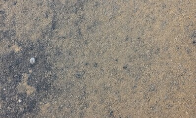 Textured sandy beach surface