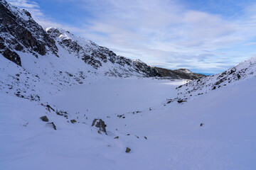 Winter in the Tatra Mountains. Frozen black pond Gasienicowy.