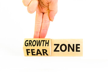 Growth or fear zone symbol. Concept words Growth zone Fear zone on wooden cubes. Beautiful white table white background. Psychologist hand. Business and growth or fear zone concept. Copy space.