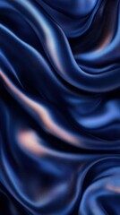 Obraz premium Smooth navy silk fabric elegantly draping in gentle waves, creating a luxurious and sophisticated texture