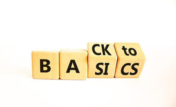 Back to basics symbol. Concept words Back to basics on wooden block. Beautiful white table white background. Business back to basics concept. Copy space.