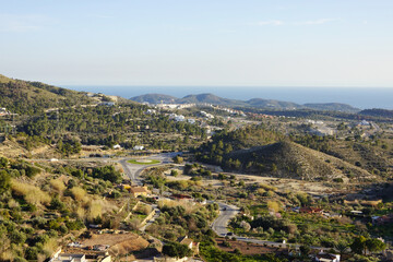 Fototapeta premium The view from Finestrat village in the direction of Benidorm and seaside, Spain