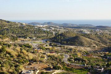 Obraz premium The view from Finestrat village in the direction of Benidorm and seaside, Spain