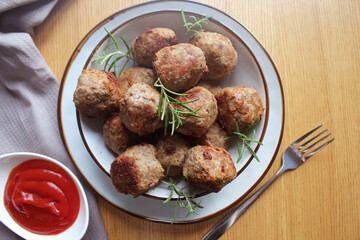Fried meat ball, delicious meat cutlets on wooden table