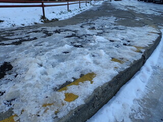 frozen icy sidewalk in a city