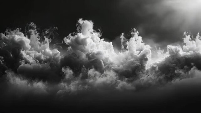 thick gray fog softly swirling against a backdrop of darkness. This atmospheric image of mist captures the ethereal beauty of nature's veiled mystery