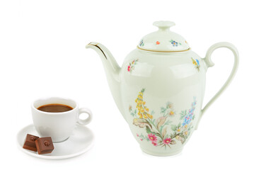 Elegant vintage porcelain coffee pot and a cup of coffee isolated on white background.