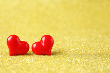 Red decorative hearts on shiny golden background, space for text. Happy Valentine's day