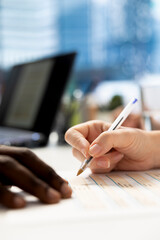 HR professional signing documents after ensuring job candidate possesses necessary qualifications...