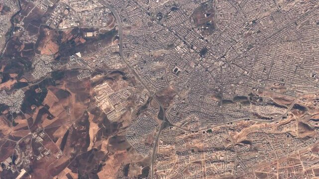 Aerial high altitude airplane top down view of Sulaymaniyah or Slemani is a city in east of Kurdistan Region of Iraq founded in 1784 by the Ottoman-Kurdish prince Ibrahim Pasha Baban 4k animation