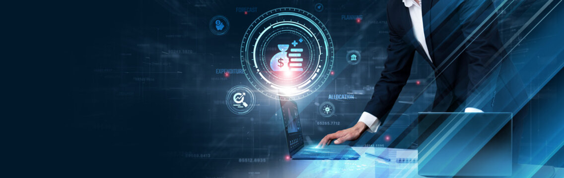 Budget: Businessman use laptop and synchronize data of financial planning on computer device with global network, cost management, expense tracking, resource allocation, financial forecasting