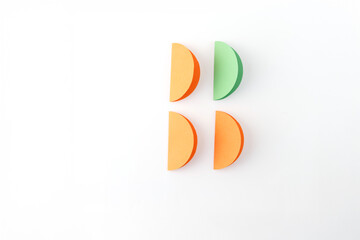 step in creative project, top view of Four semi-circular folded paper objects arranged in 2x2 grid...