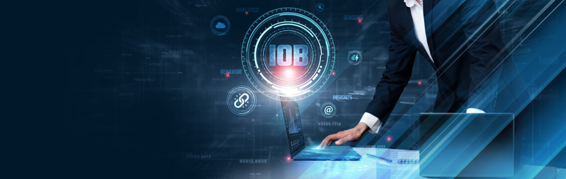 Internet of Behaviors (IoB): Businessman uses laptop and synchronizes data of user behavior analytics on computer device with global network, data tracking, predictive analysis, personalization. - Powered by Adobe