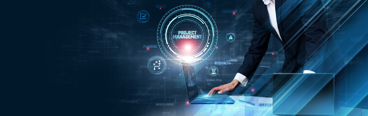 Project Management: Businessman uses laptop and synchronizes data of tasks on computer device with global network, scheduling, resource allocation, team collaboration, progress tracking, deadlines