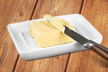 Fresh butter placed on plate. Breakfast time