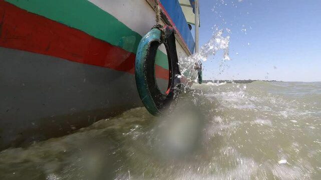 Slow motion GoPro footage of waves from tourist boat sailing over Lake Tana, the source of the Blue Nile river, in Ethiopia
