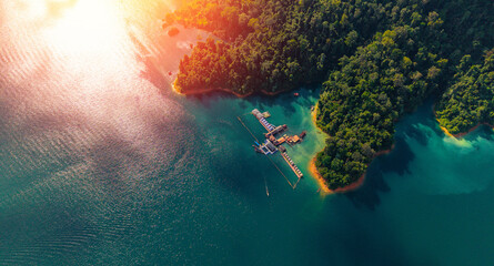 Aerial view of khao sok national park with lush forest and turquoise waters, thailand
