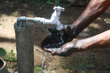 washing hands using water