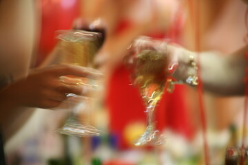 two hands with a glass