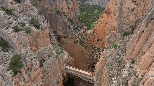 Garganta Gorge, del Chorro and Caminito del Rey, Spain. Aerial shot of a bridge in a narrow gorge, a river flows below. 