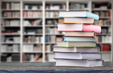 pile of old reading books on shelves in library