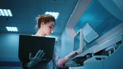 A young female robotics engineer with a laptop analyzing the concept of a robotic machine in a state-of-the-art lab. The concept of programming and data tracking to optimize robot performance. - Powered by Adobe