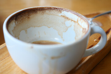 Coffee cup with remnants after enjoying a warm beverage in a cafe