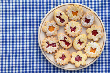 Linzer cookies filled with strawberry and apricot jam. Easter baking