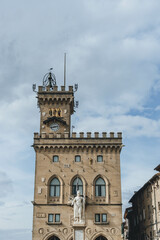 Fototapeta premium the tower of the townhall with statue of woman victory in san marino city main square