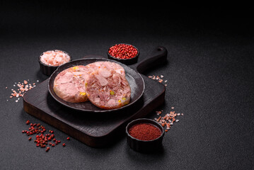 Homemade brawn with salt, spices, herbs and vegetables