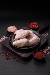 Raw chicken wings with salt, spices and herbs