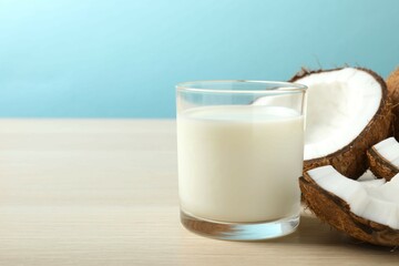 Glass of milk with coconuts on the table