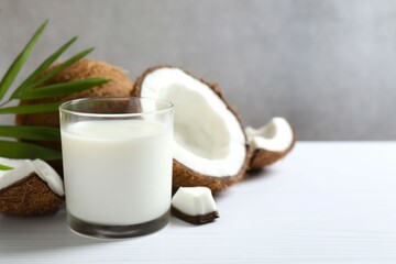 Glass of milk with coconuts on the table