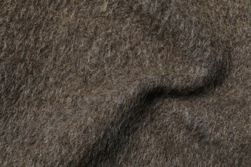 Brown fabric background, close up view